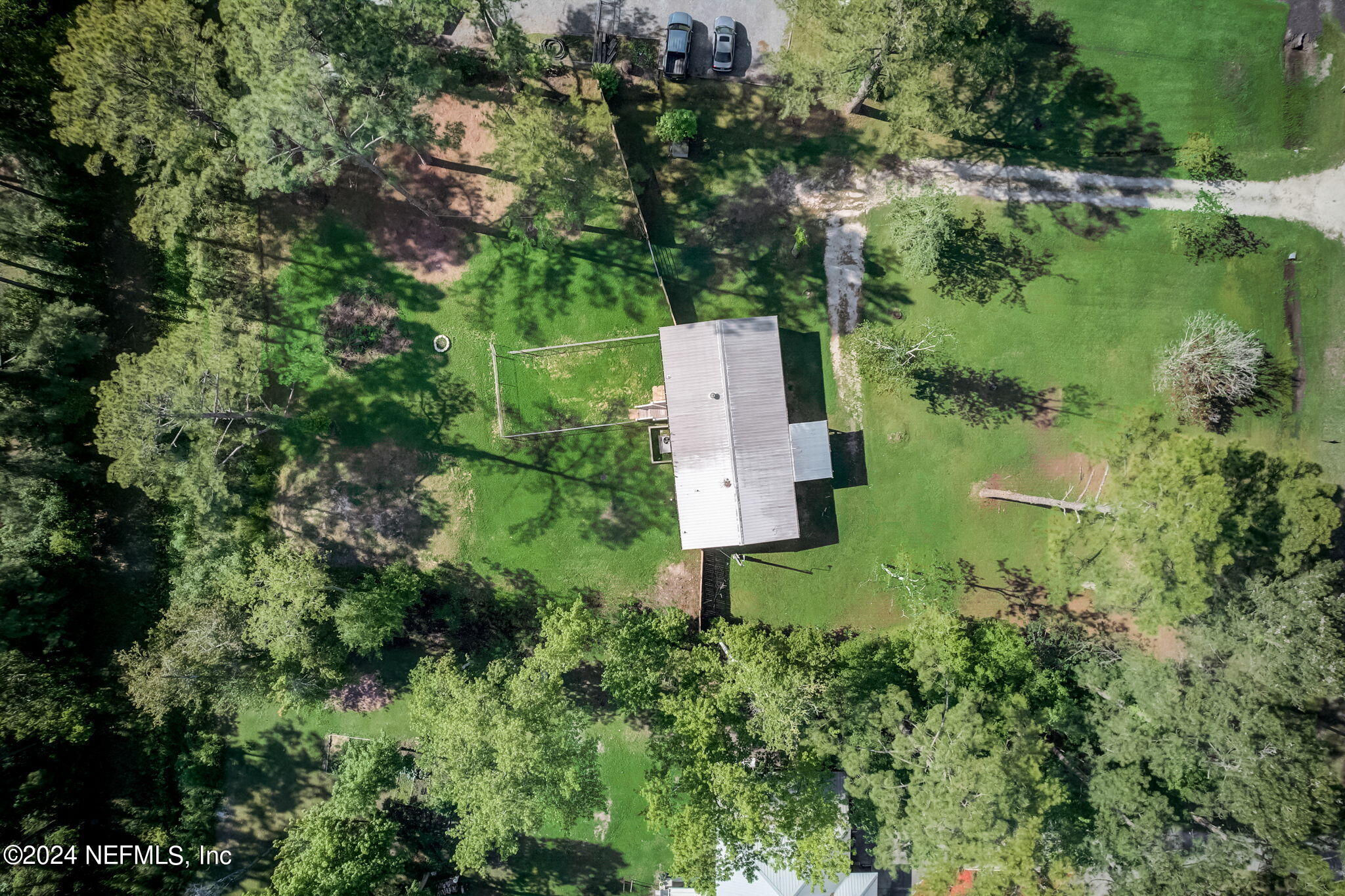 54262 Vikki Road Callahan, FL 32011 - Photo 35 of 48 an aerial view of residential house with outdoor space and trees all around