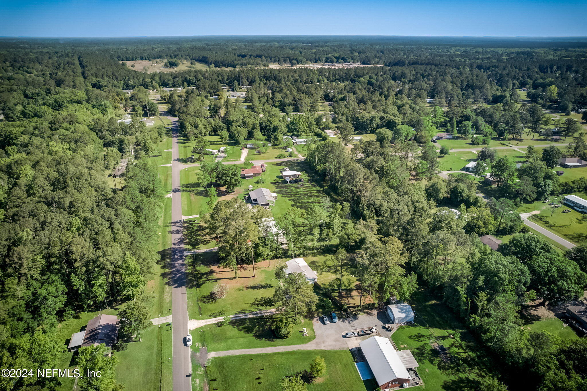 54262 Vikki Road Callahan, FL 32011 - Photo 40 of 48 an aerial view of a residential houses covered in trees