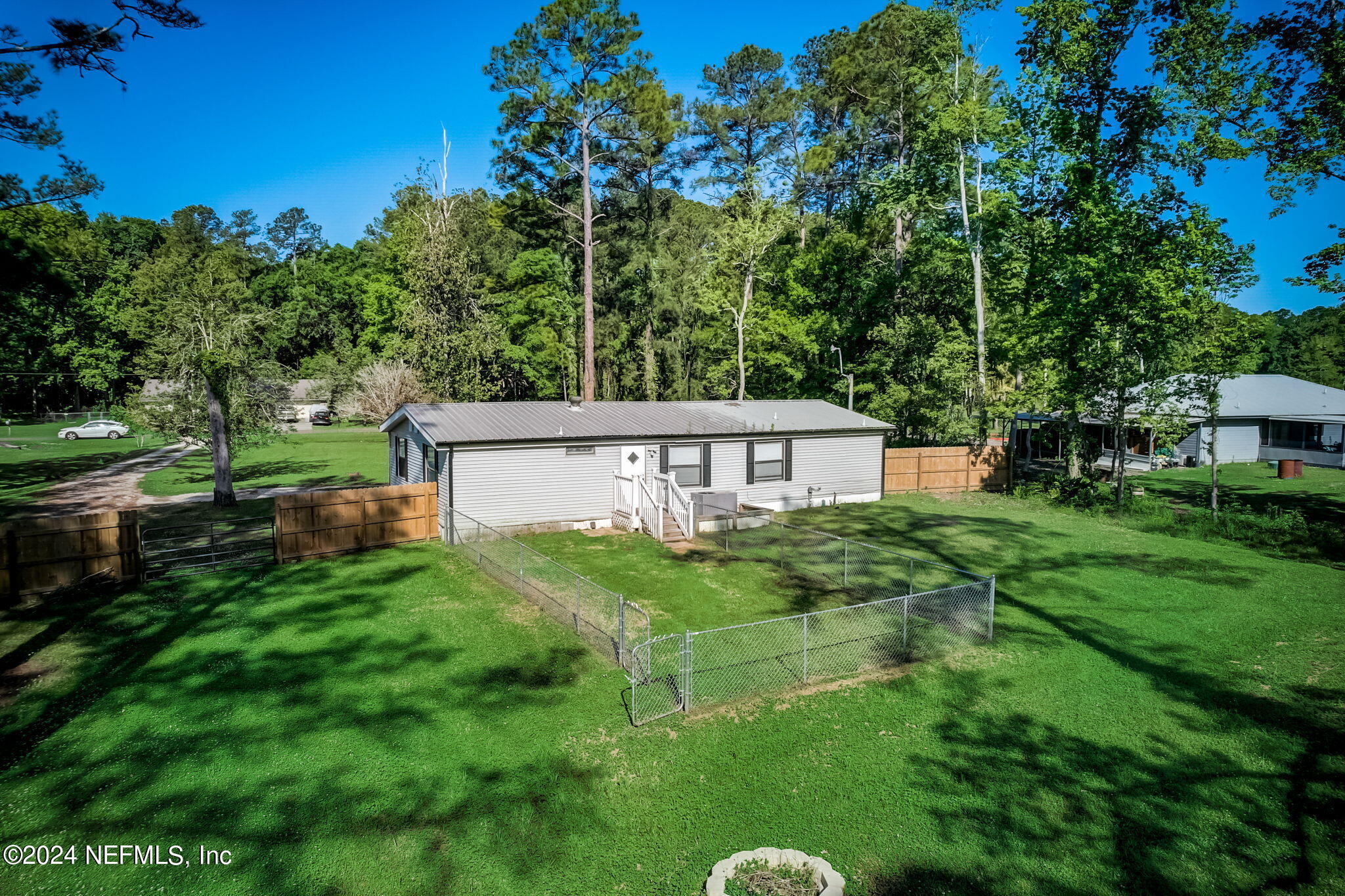 54262 Vikki Road Callahan, FL 32011 - Photo 45 of 48 a view of a house with a yard