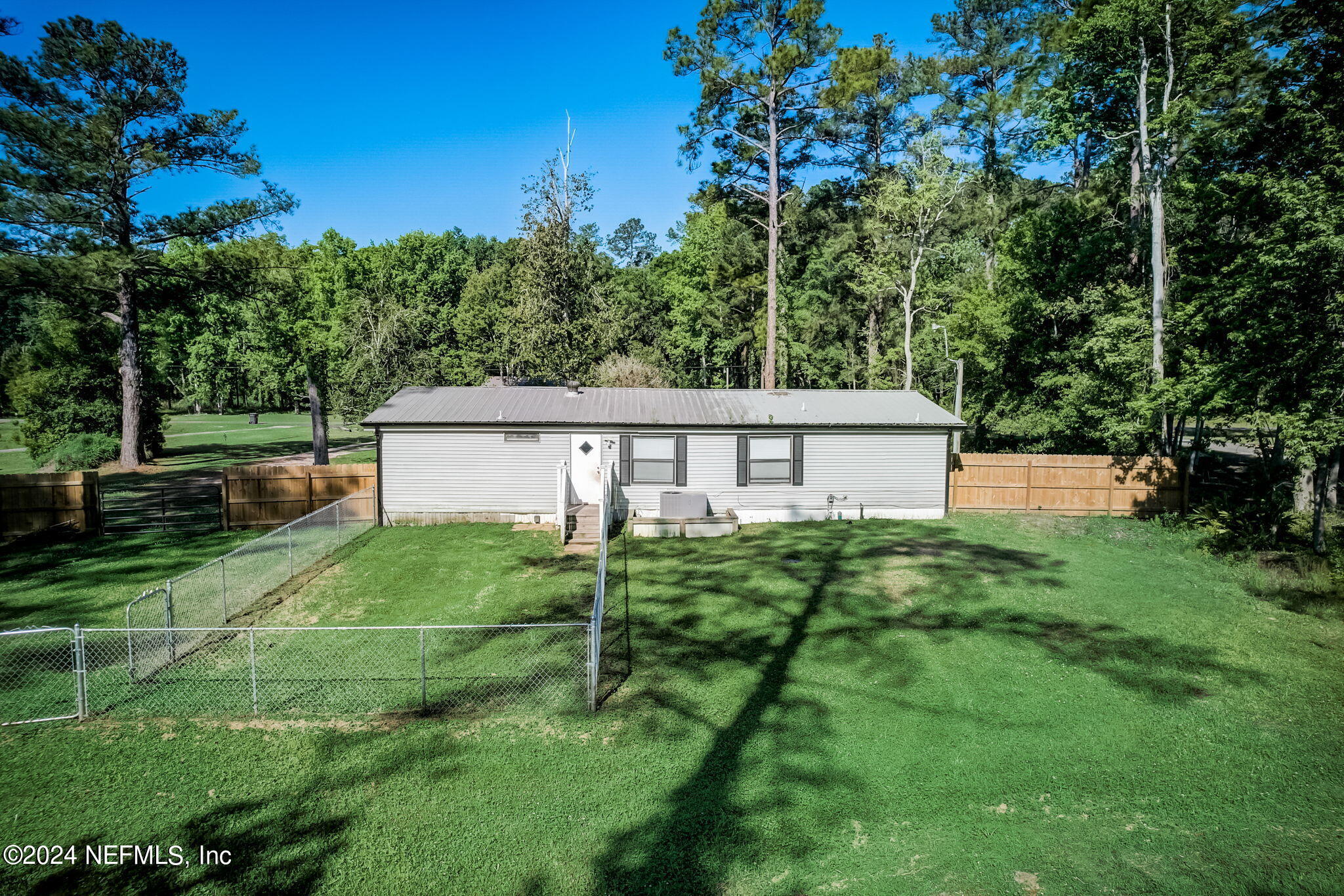 54262 Vikki Road Callahan, FL 32011 - Photo 46 of 48 a view of a house with a backyard