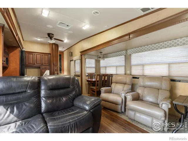 a living room with furniture and a lamp