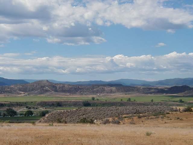 141 225th Road Rifle, CO 81650 - Photo 1 of 1 a view of a lake with a mountain in the background