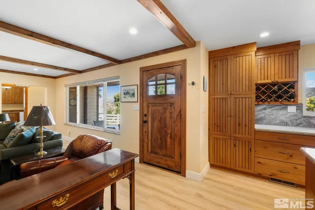 a living room with furniture a rug and a fireplace