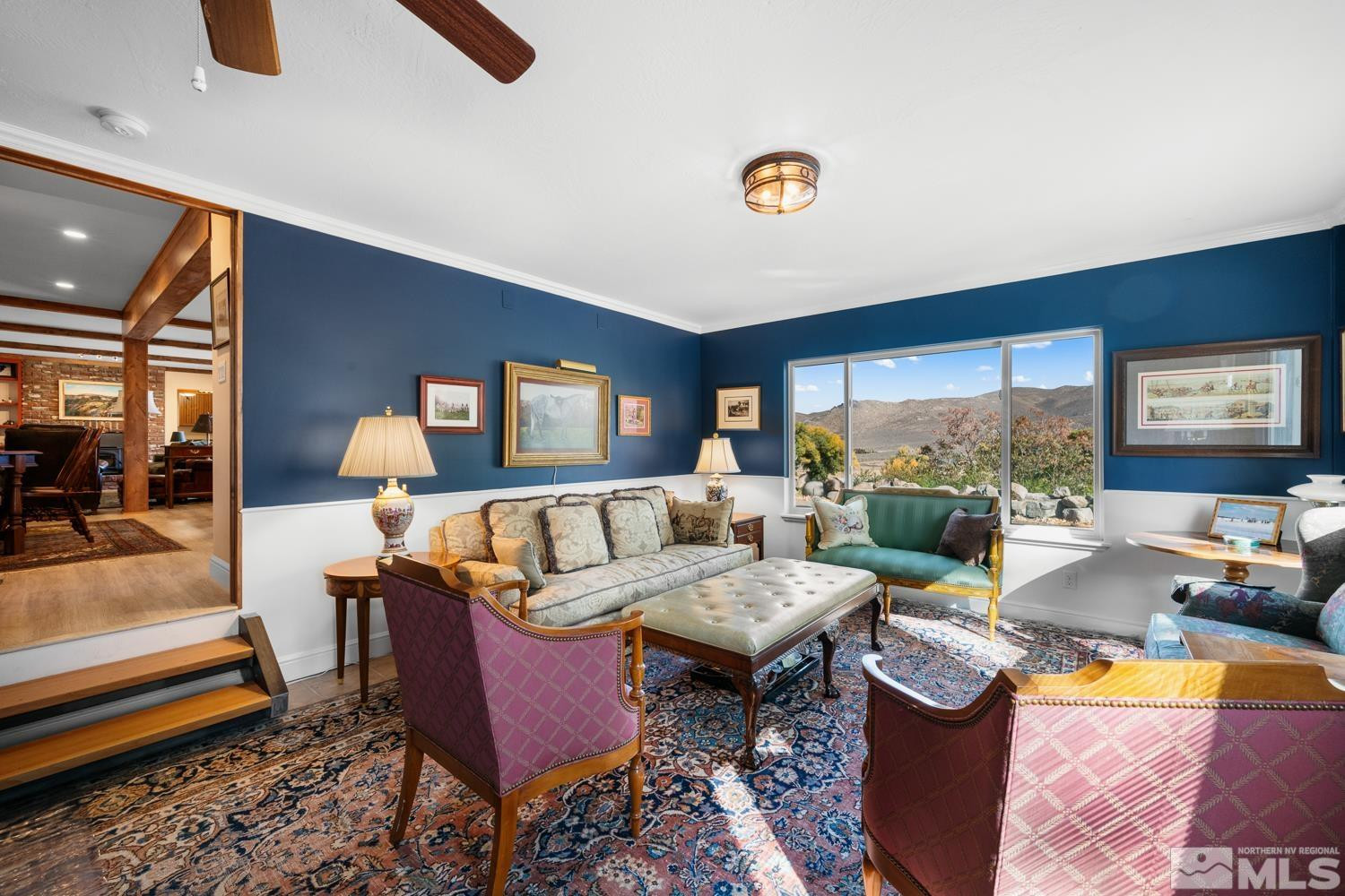 14005 North Red Rock Road Reno, NV 89508 - Photo 33 of 39 a living room with furniture and a floor to ceiling window