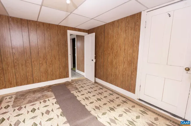 a kitchen with a stove a refrigerator and a cabinets