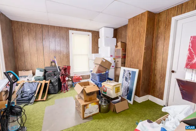 a room with furniture a washer and dryer