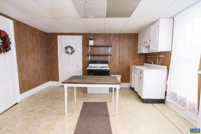 a bathroom with a double vanity sink toilet and shower