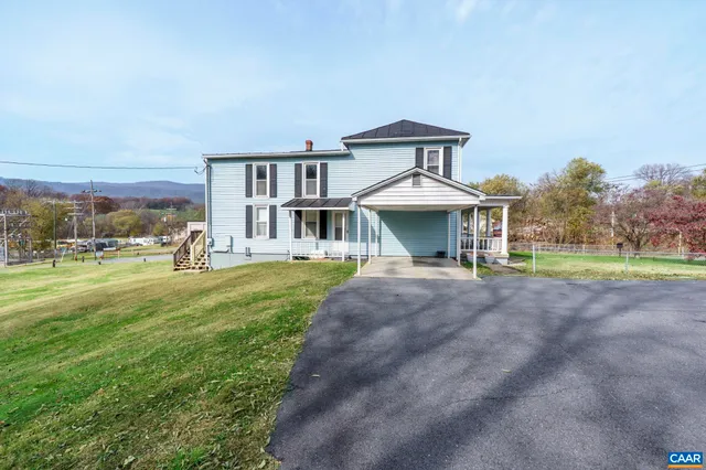 an aerial view of a house having swimming pool