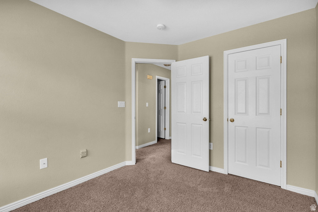 14108 Pepi Band Road Draper, UT 84020 - Photo 24 of 36 Neutral-toned walls complement the brown carpeted flooring