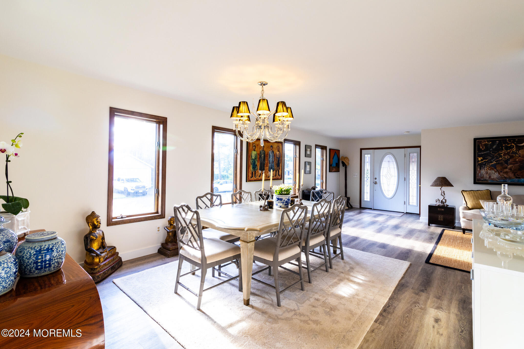565 Princeton Avenue Brick, NJ 08724 - Photo 13 of 66 a view of a dining room with furniture a chandelier and wooden floor