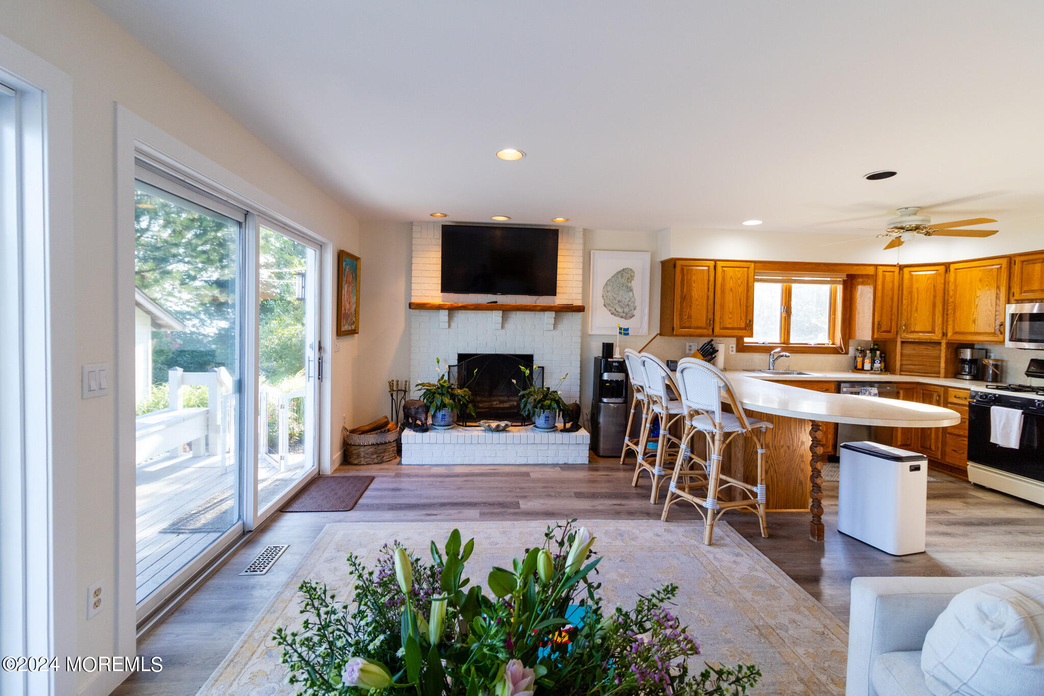565 Princeton Avenue Brick, NJ 08724 - Photo 16 of 66 a living room with furniture a fireplace and a flat screen tv