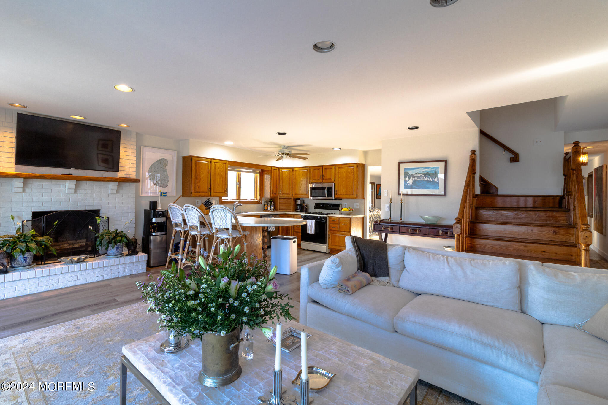 565 Princeton Avenue Brick, NJ 08724 - Photo 18 of 66 a living room with furniture kitchen view and a fireplace