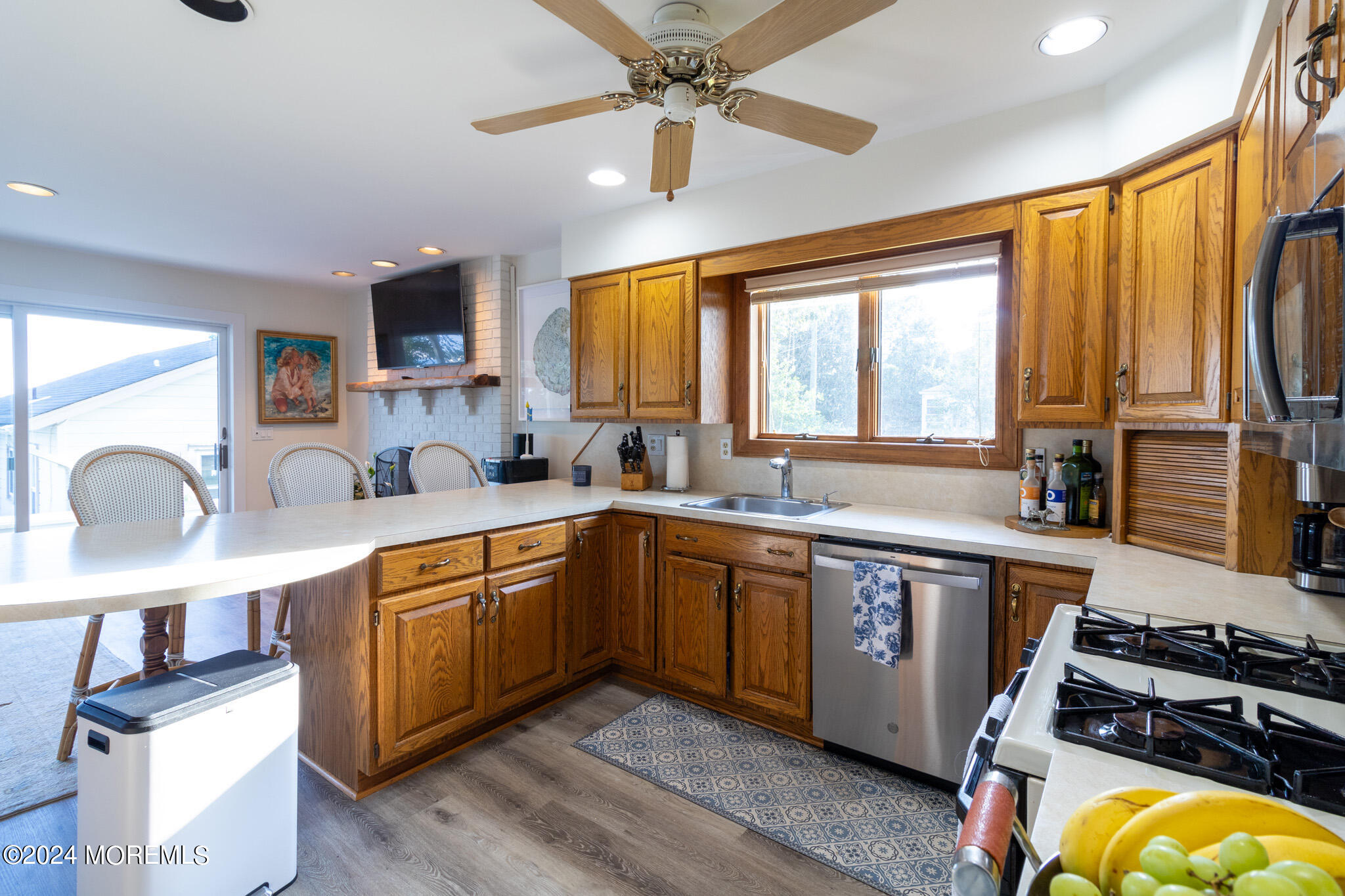 565 Princeton Avenue Brick, NJ 08724 - Photo 22 of 66 a kitchen with stainless steel appliances granite countertop a sink stove and refrigerator