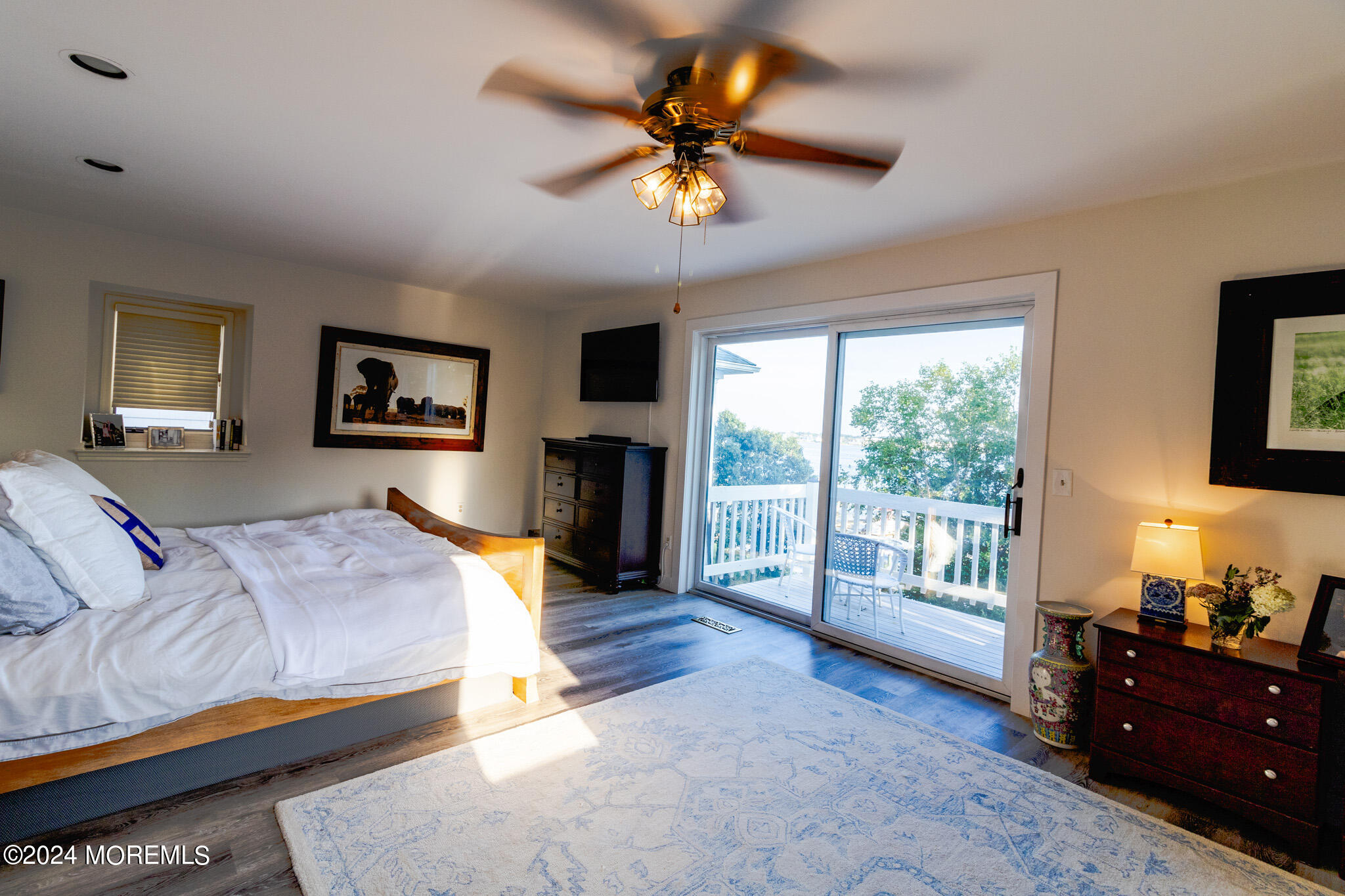 565 Princeton Avenue Brick, NJ 08724 - Photo 27 of 66 a bedroom with a bed and a chandelier