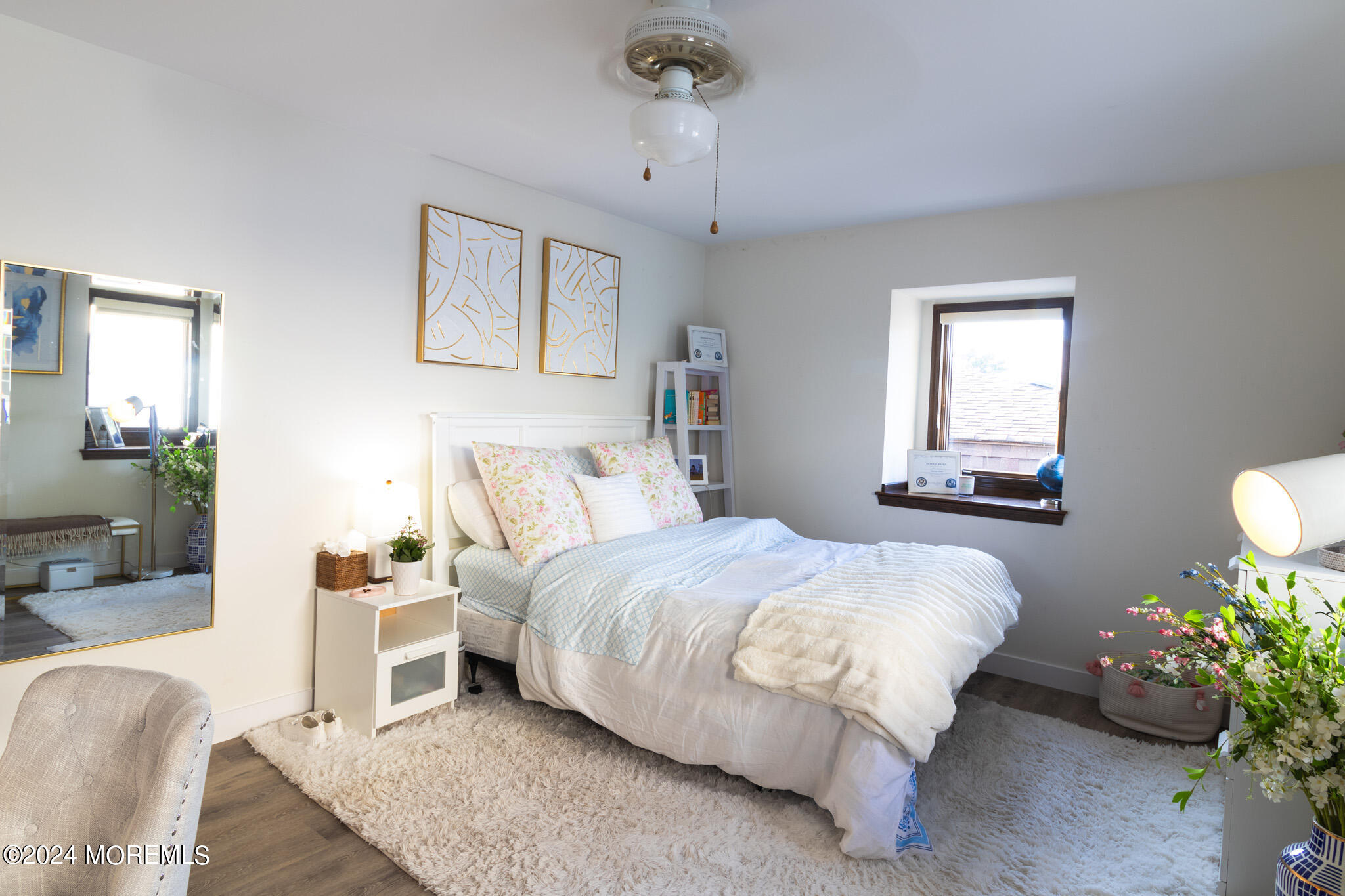 565 Princeton Avenue Brick, NJ 08724 - Photo 31 of 66 a bed room with a bed mirror and a couch