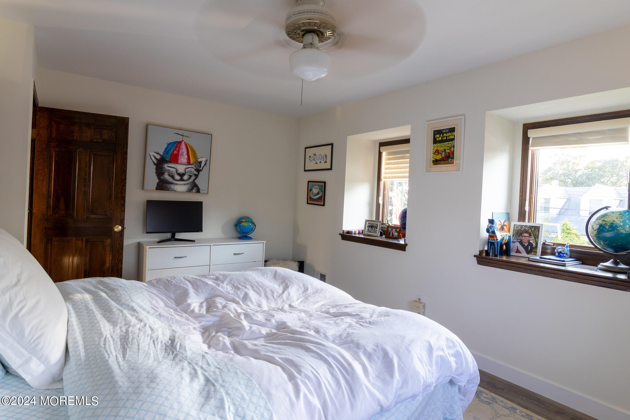 565 Princeton Avenue Brick, NJ 08724 - Photo 33 of 66 a bedroom with a bed and a dresser next to a window