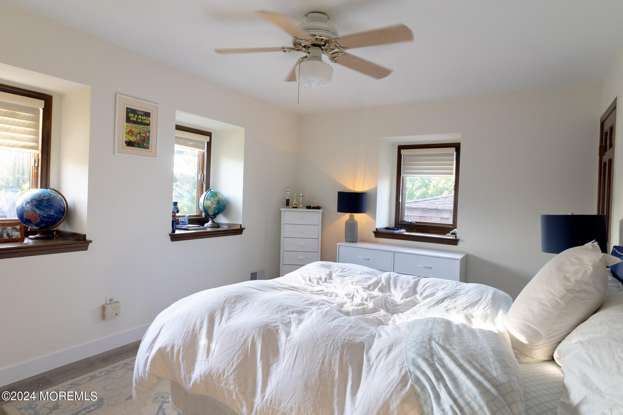 565 Princeton Avenue Brick, NJ 08724 - Photo 34 of 66 a bedroom with a bed and a chandelier