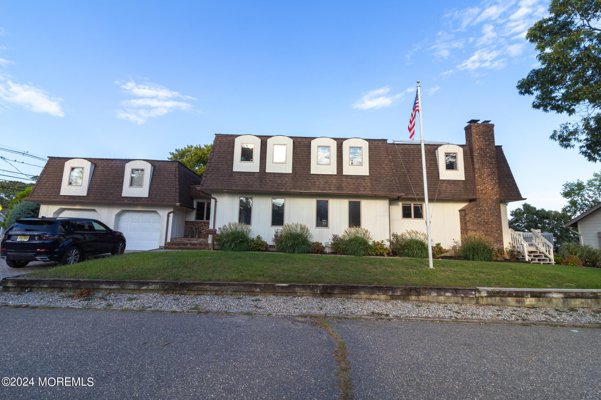 565 Princeton Avenue Brick, NJ 08724 - Photo 5 of 66 a front view of a house with a yard