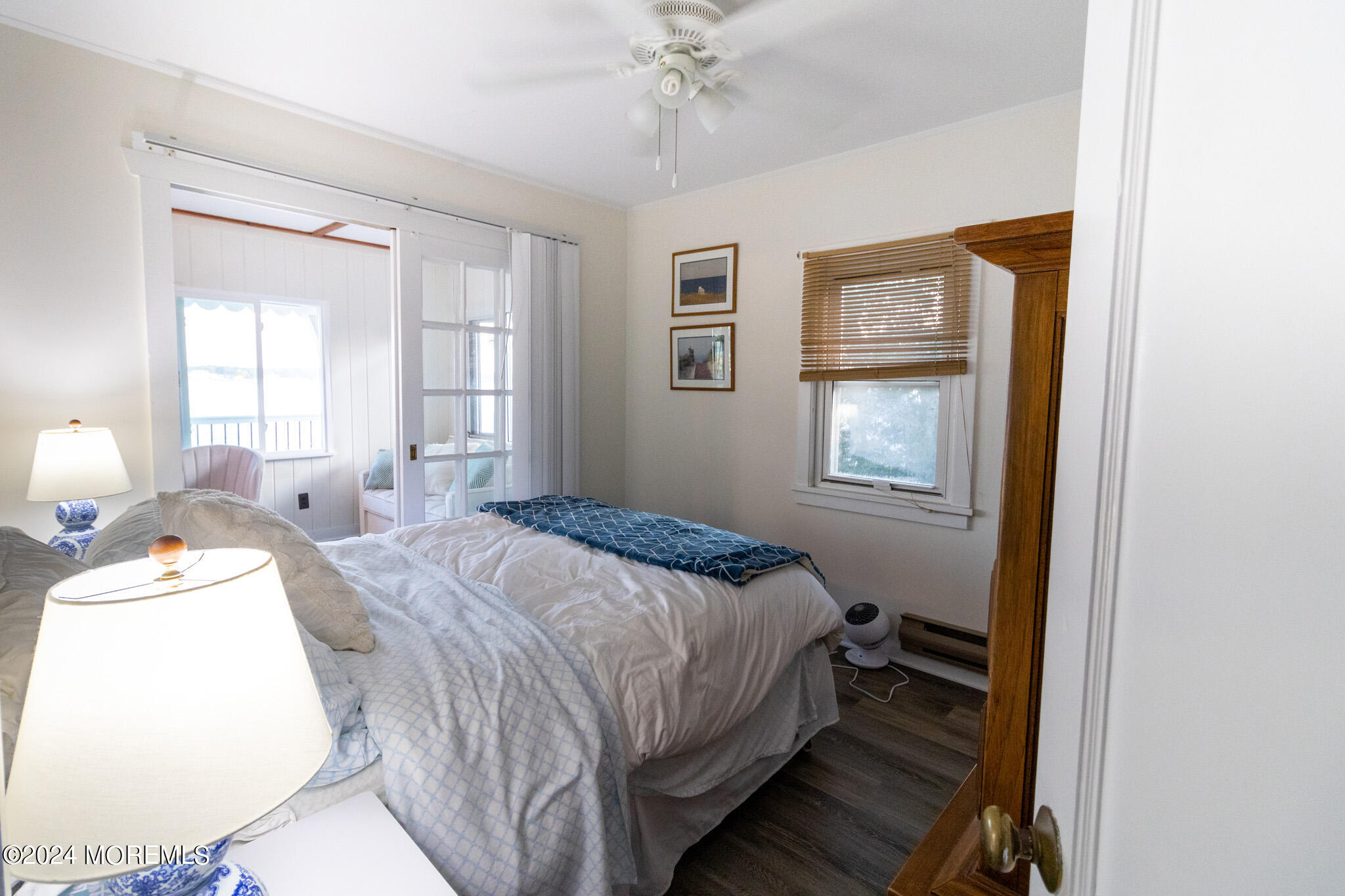 565 Princeton Avenue Brick, NJ 08724 - Photo 51 of 66 a bedroom with a bed and a chandelier