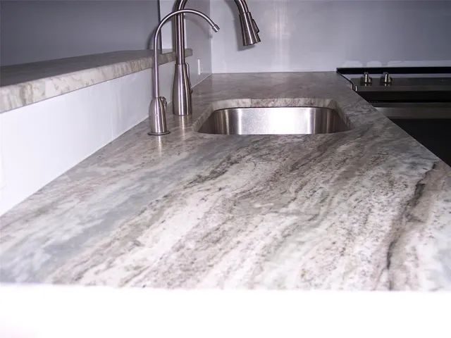 a kitchen with stainless steel appliances a refrigerator and a sink