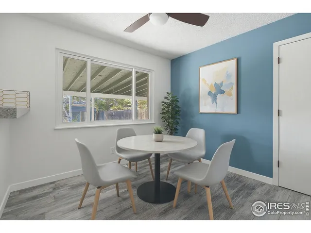 a view of a dining room with furniture and window