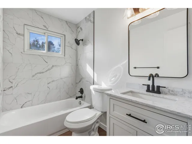 a bathroom with a sink a toilet and a bathtub