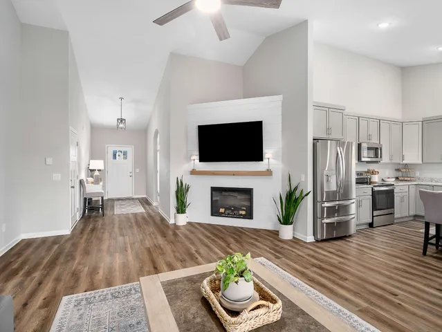 a living room with furniture and a fireplace