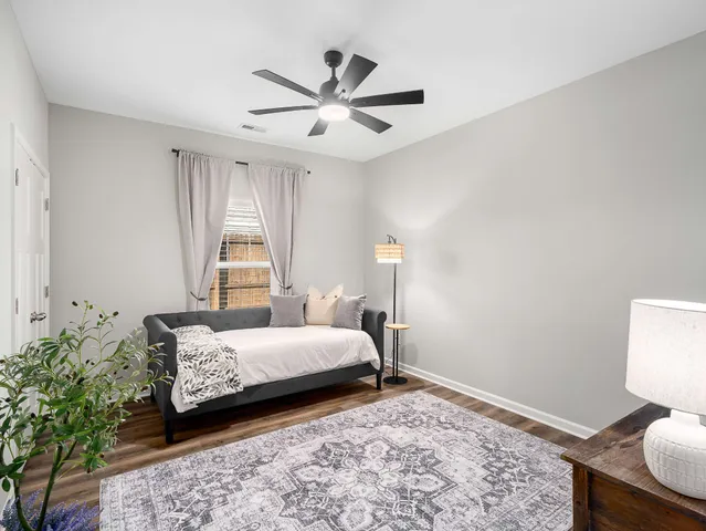 a bedroom with a bed and window