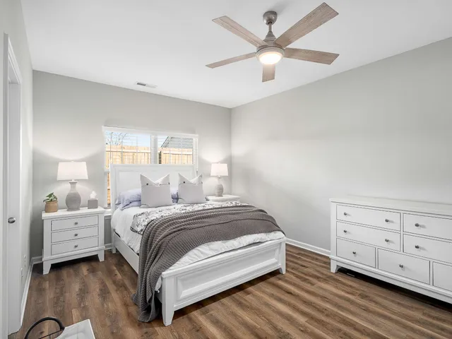 a bedroom with a bed and a dresser