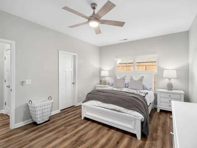 a bedroom with bed and window