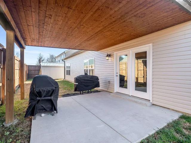 a view of backyard with cabin