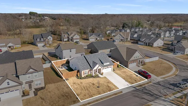 an aerial view of a house having yard