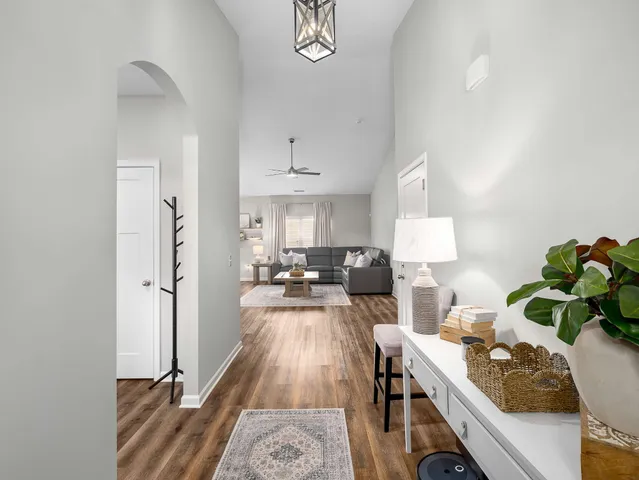 a living room with furniture and a table