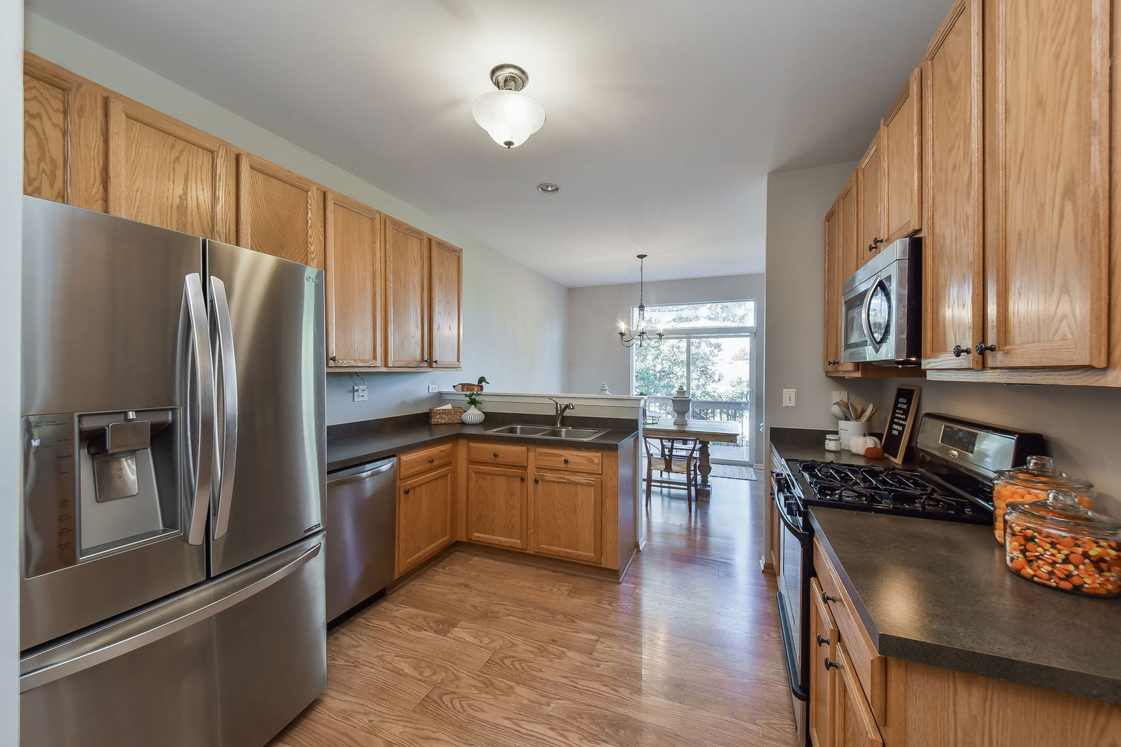 247 Grand Ridge Road St. Charles, IL 60175 - Photo 5 of 17 a kitchen with stainless steel appliances granite countertop a refrigerator stove top oven and sink