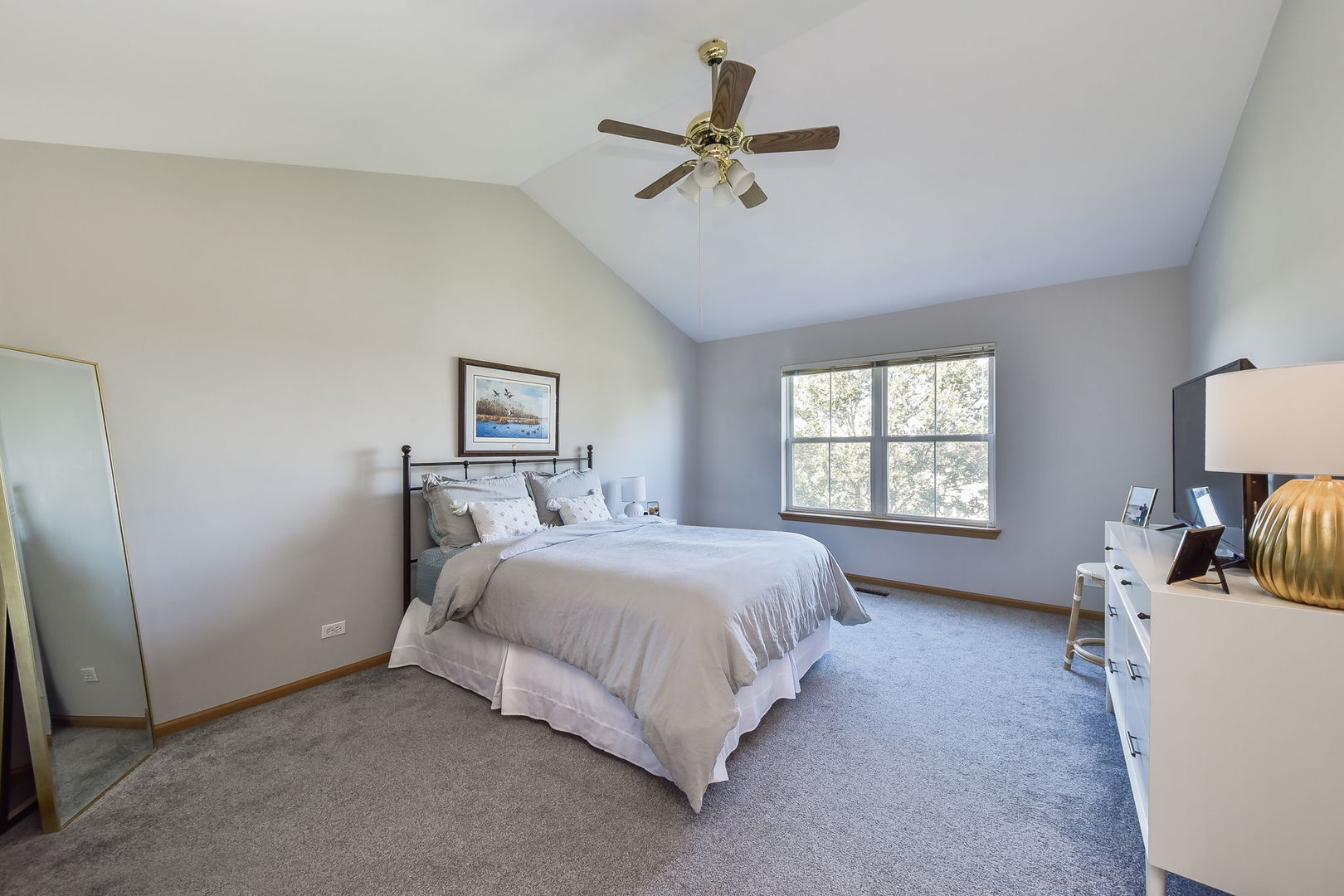 247 Grand Ridge Road St. Charles, IL 60175 - Photo 10 of 17 a bedroom with a bed a couch and a window