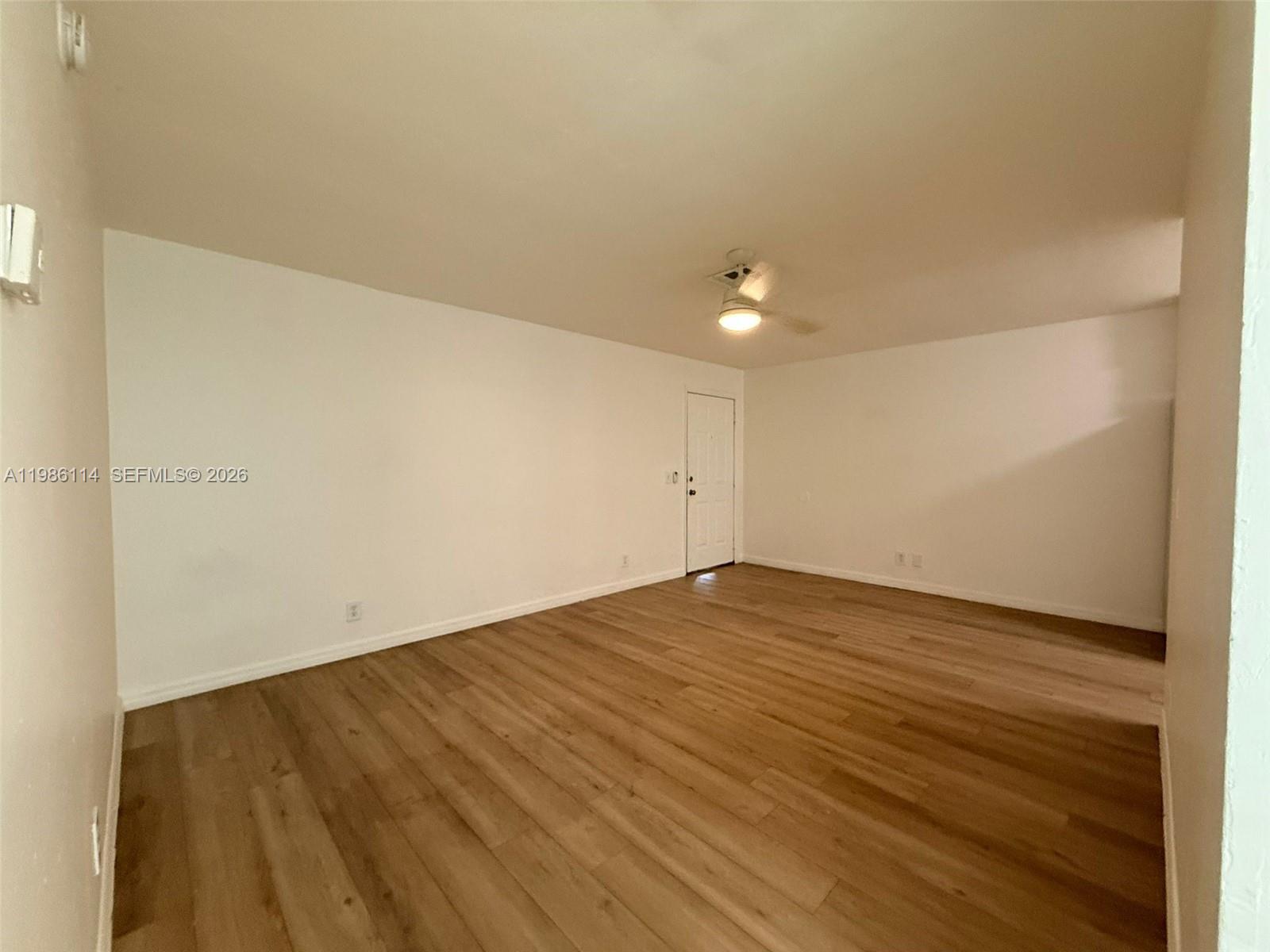 2919 Jackson Street, Unit 4 Fort Myers, FL 33901 - Photo 4 of 13 an empty room with wooden floor