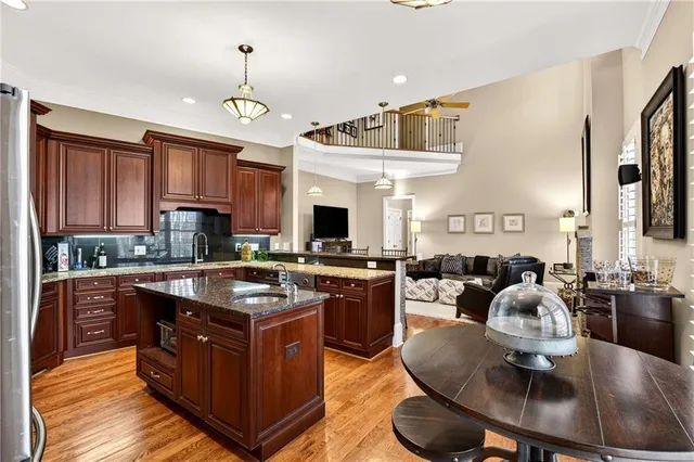 a living room with furniture fireplace and wooden floor