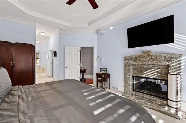 a spacious bedroom with a bed and a window