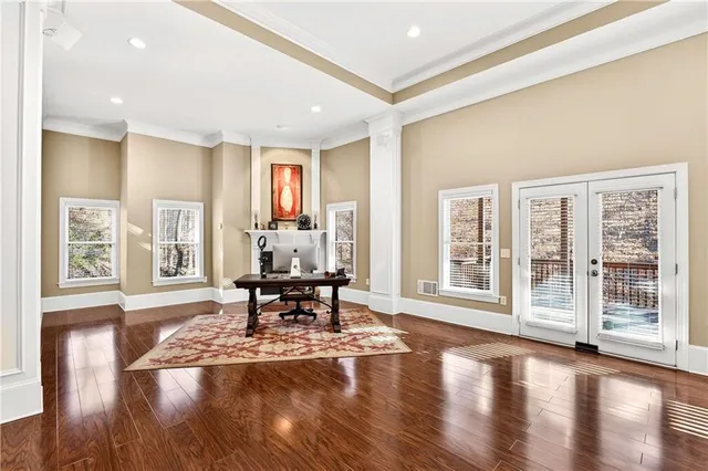 an aerial view of a house with a yard and sitting area
