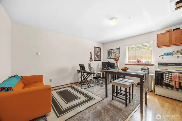 a work room with furniture and a flat screen tv