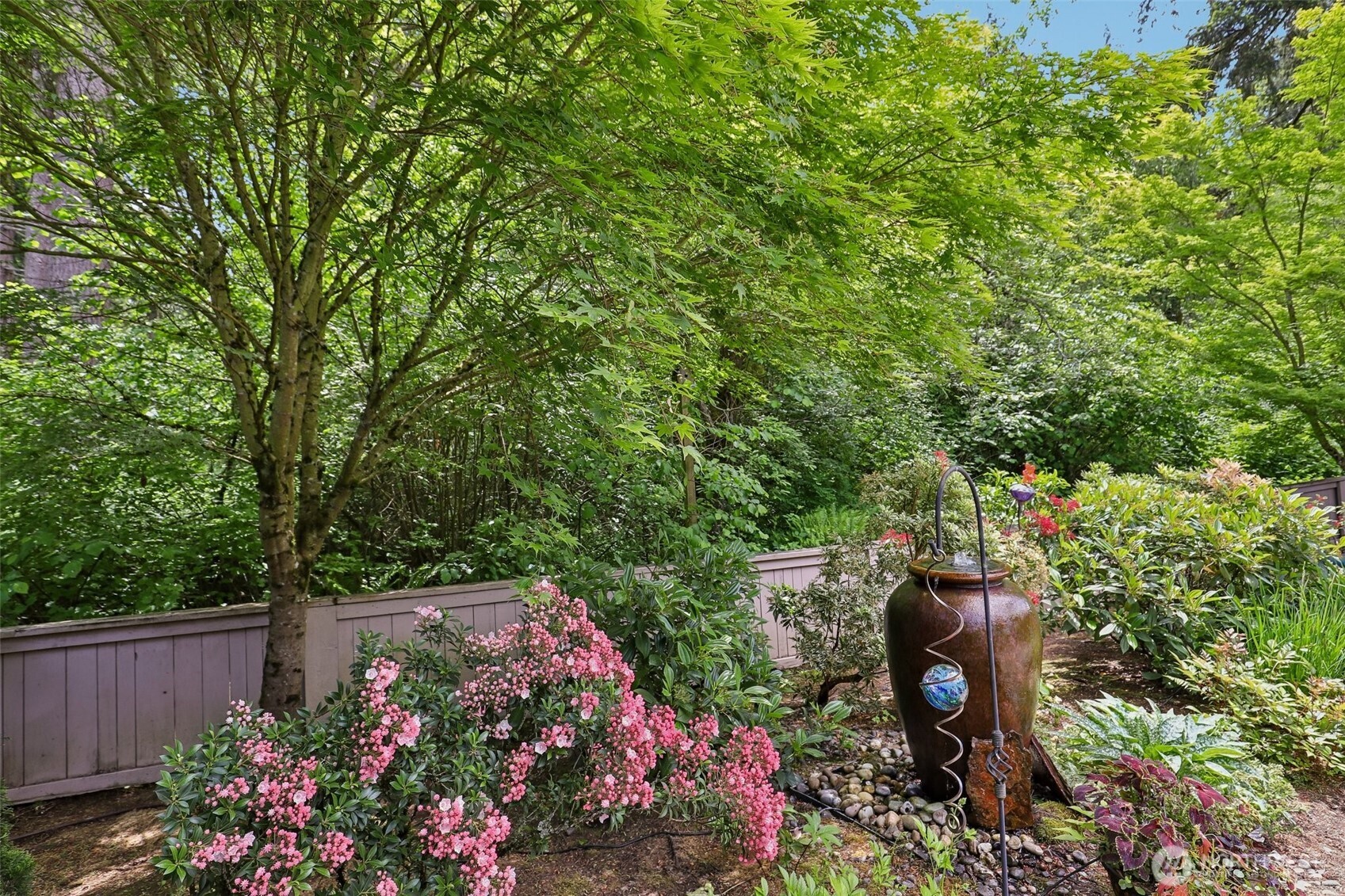 19709 Southeast 26th Way Camas, WA 98607 - Photo 3 of 36 a view of a garden with flowers and trees