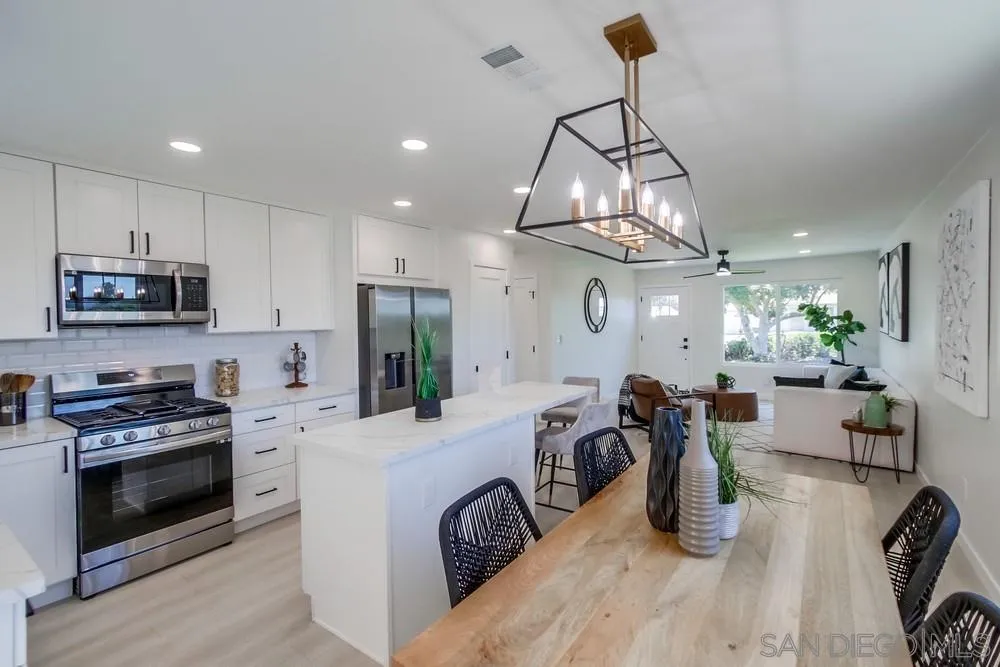 12736 Roberto Way Poway, CA 92064 - Photo 11 of 34 a kitchen with counter top space appliances and wooden floor