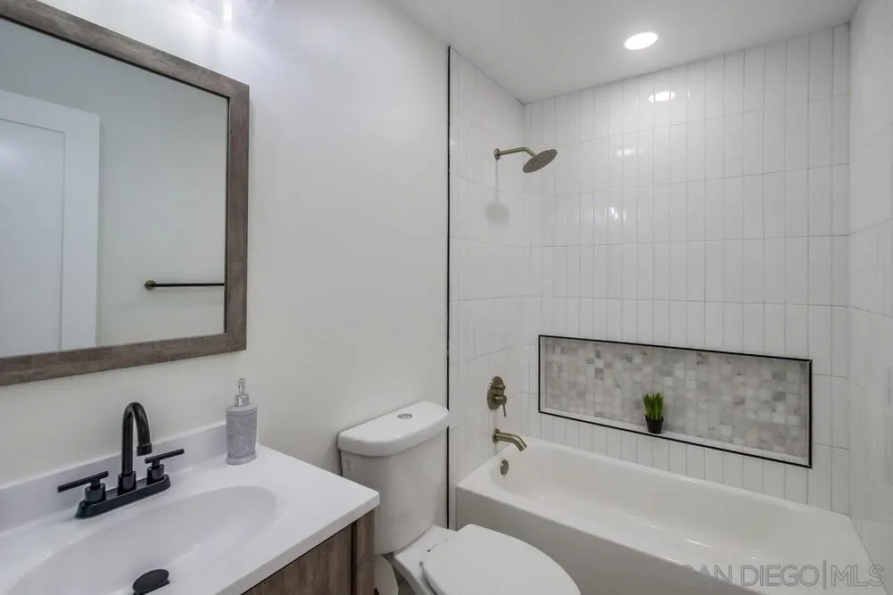 12736 Roberto Way Poway, CA 92064 - Photo 15 of 34 a bathroom with a sink toilet and shower