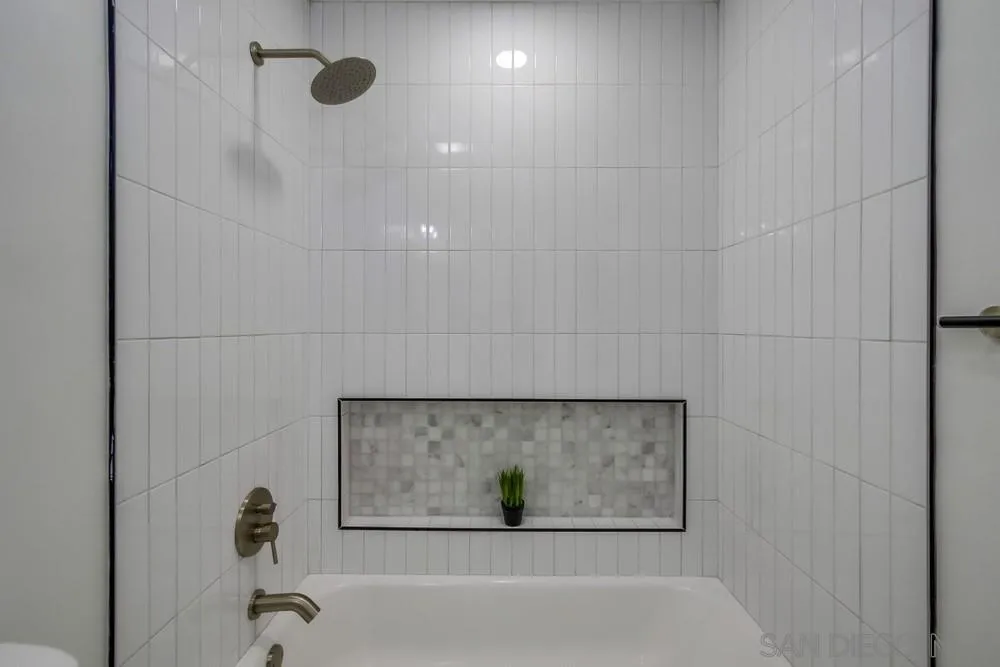 12736 Roberto Way Poway, CA 92064 - Photo 16 of 34 a bathroom with a bathtub and shower