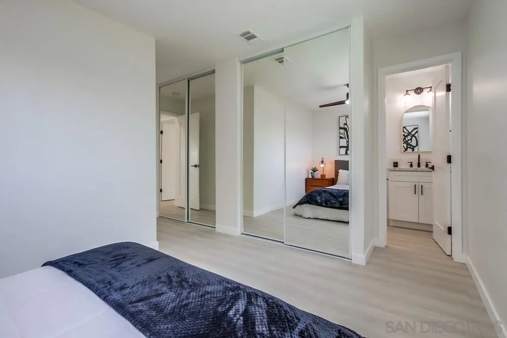12736 Roberto Way Poway, CA 92064 - Photo 22 of 34 a living room with a bed and a view of bedroom