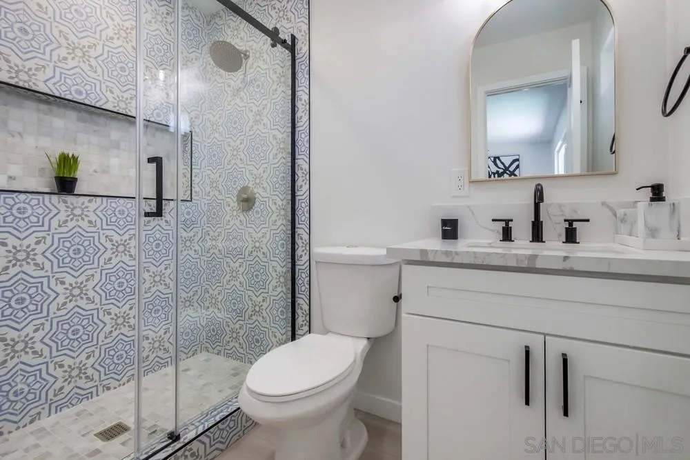 12736 Roberto Way Poway, CA 92064 - Photo 23 of 34 a bathroom with a sink toilet and shower