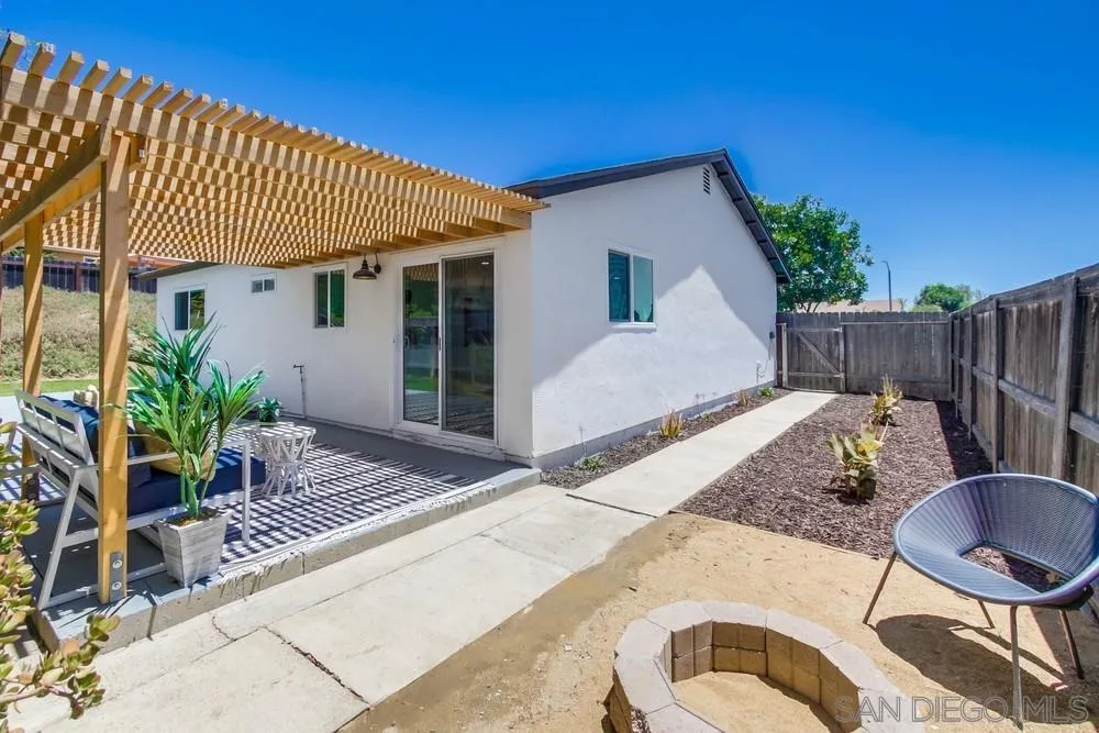 12736 Roberto Way Poway, CA 92064 - Photo 25 of 34 a view of a house with backyard and sitting area