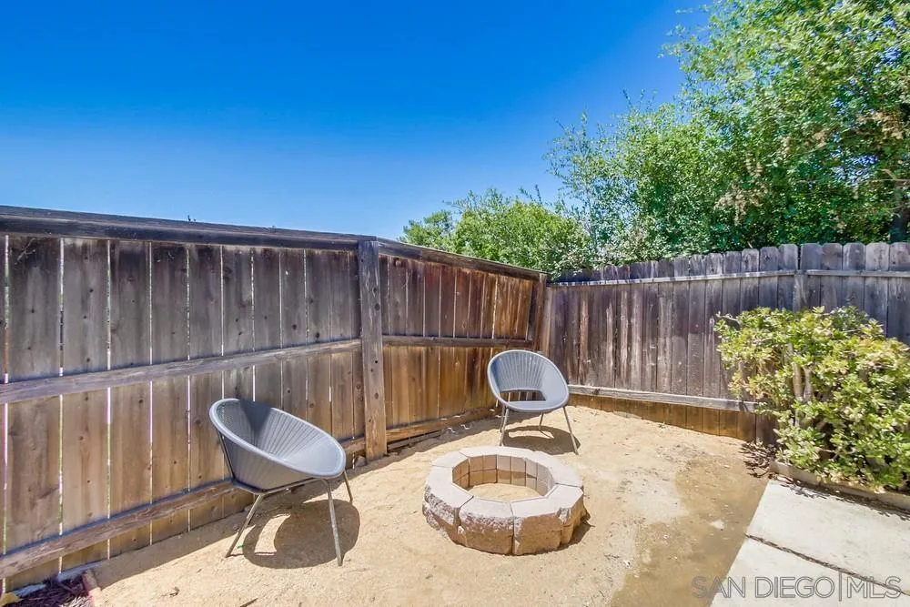 12736 Roberto Way Poway, CA 92064 - Photo 26 of 34 a backyard of a house with table and chairs