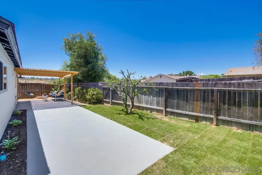 12736 Roberto Way Poway, CA 92064 - Photo 30 of 34 a view of a backyard with wooden fence