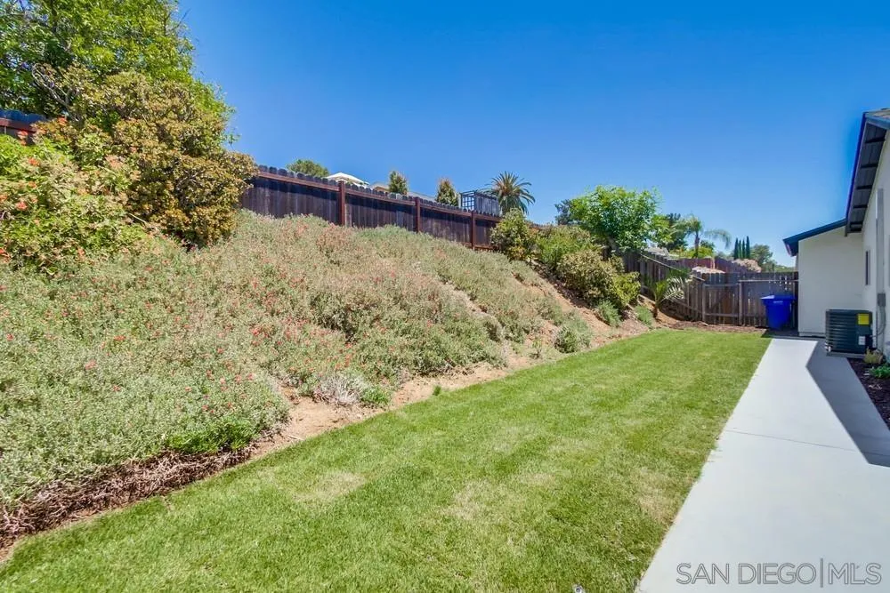 12736 Roberto Way Poway, CA 92064 - Photo 32 of 34 a view of a backyard with plants and a patio